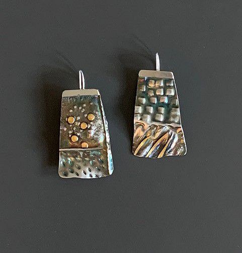 Elyse Bogart, #465 EARRINGS
Fold-Formed, Chased, and Hammer-Textured Sterling Silver, 22K Gold, Patina
EBOG#465
$395
Gallery staff will contact you 72 hours after purchase regarding any additional shipping costs.